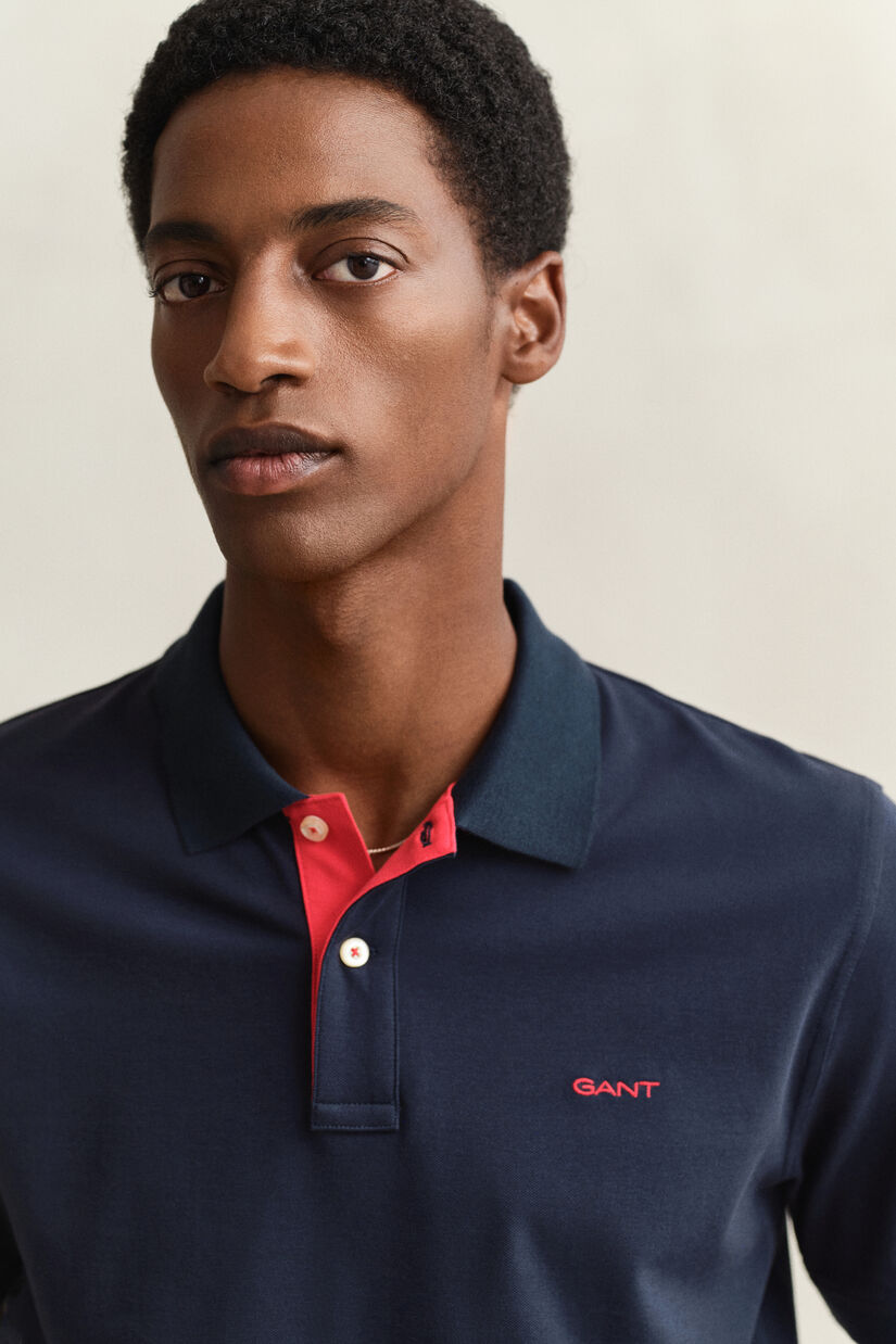 Piqu&eacute; poloshirt met contrasterend detail