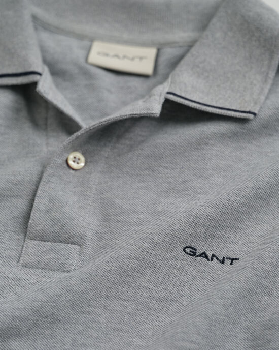 Piqu&eacute; poloshirt met randdetails