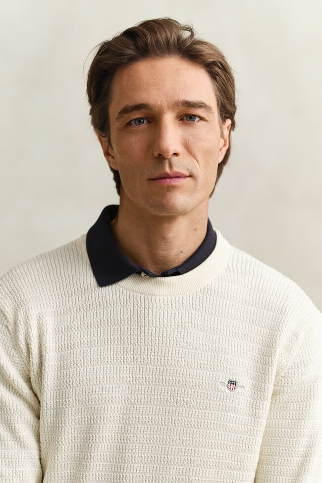 Gebreide trui met minikabels en ronde hals