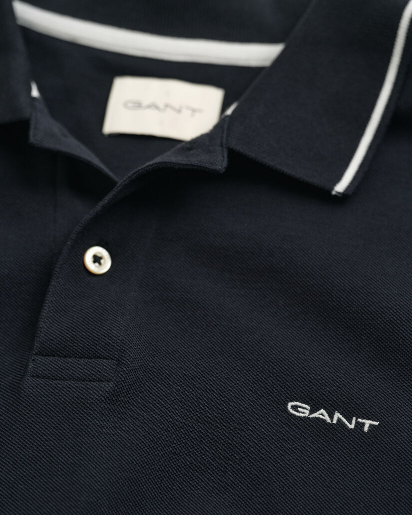 Piqu&eacute; poloshirt met randdetails